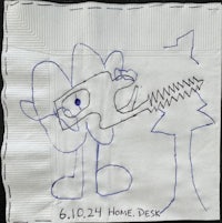 a napkin with a drawing of a child holding a knife