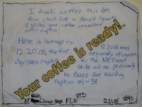 a note on a wall that says your coffee is ready