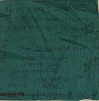 a green napkin with writing on it