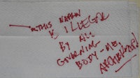 a handwritten note on a napkin