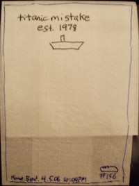 a napkin with a drawing of a ship on it