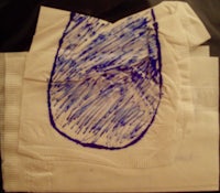 a piece of paper with a blue drawing on it