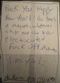 a handwritten note that says fuck you happy new year