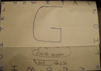 a piece of paper with the letter g on it